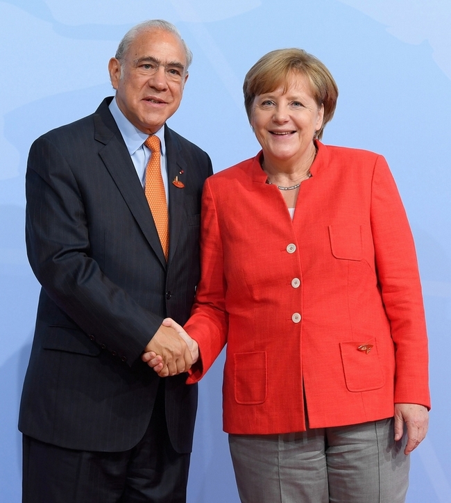 OECD Secretary-General Angel Gurría and German Chancellor Angela Merkel during the G20 Hamburg summit in July 2017. (Photo by OECD, CC BY-NC 2.0) OECD Secretary-General Angel Gurría and German Chancellor Angela Merkel during the G20 Hamburg summit in July 2017. (Photo by OECD, CC BY-NC 2.0)